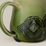 Close-up details of hand-thrown mug by Rookwood