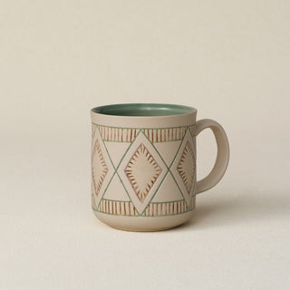 Hand-thrown ceramic mug by Rookwood Pottery