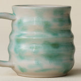 Close-up details of hand-thrown mug by Rookwood