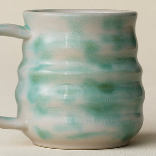 Close-up details of hand-thrown mug by Rookwood