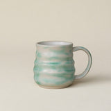 Hand-thrown ceramic mug by Rookwood Pottery