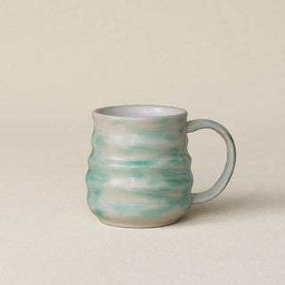 Hand-thrown ceramic mug by Rookwood Pottery