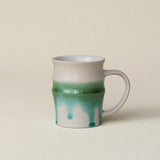 Hand-thrown ceramic mug by Rookwood Pottery