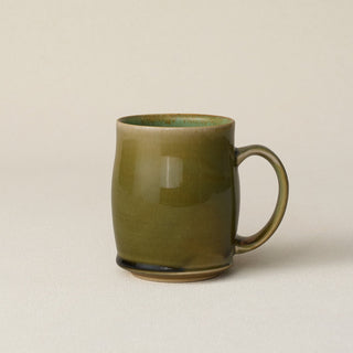 Hand-thrown ceramic mug by Rookwood Pottery