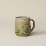 Hand-thrown ceramic mug by Rookwood Pottery