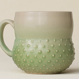 Close-up details of hand-thrown mug by Rookwood