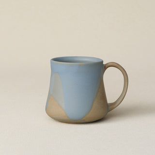 Hand-thrown ceramic mug by Rookwood Pottery