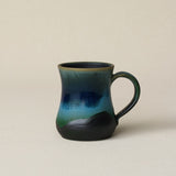 Hand-thrown ceramic mug by Rookwood Pottery