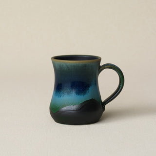 Hand-thrown ceramic mug by Rookwood Pottery