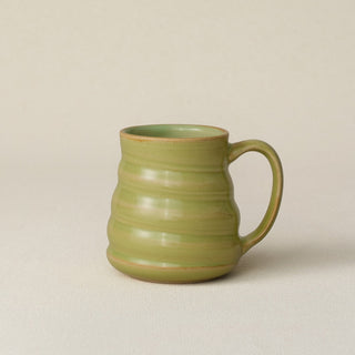Hand-thrown ceramic mug by Rookwood Pottery