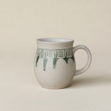 Hand-thrown ceramic mug by Rookwood Pottery