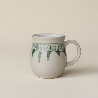 Hand-thrown ceramic mug by Rookwood Pottery