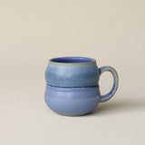 Hand-thrown ceramic mug by Rookwood Pottery