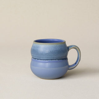 Hand-thrown ceramic mug by Rookwood Pottery