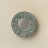 Hand-thrown and hand-glazed ceramic wall mirror by Rookwood Pottery