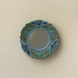 Hand-thrown and hand-glazed ceramic wall mirror by Rookwood Pottery