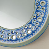 Close-up details of the one-of-a-kind mirror.