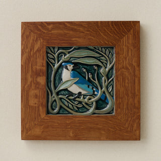 Rookwood Serviceberry Blue Jay revival bird art tile in a golden oak wood frame
