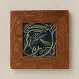 Rookwood Serviceberry Rook revival bird art tile in a golden oak wood frame