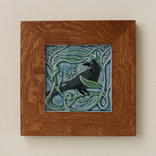 Rookwood Winterberry Rook revival bird art tile in a golden oak wood frame