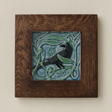 Rookwood Winterberry Rook revival bird art tile in a dark walnut wood frame