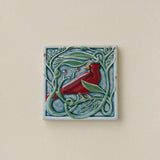 Hand-painted Rookwood Winterberry Cardinal revival bird art tile in cool blue winter tones, unframed