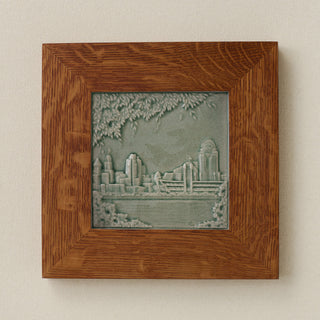 Rookwood Cincinnati Skyline City Scene art tile in a golden oak wood frame