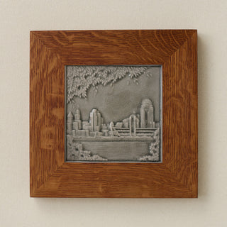Rookwood Cincinnati Skyline City Scene art tile in a golden oak wood frame
