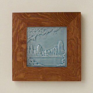 Rookwood Cincinnati Skyline City Scene art tile in a golden oak wood frame