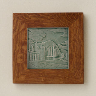 Rookwood Union Terminal City Scene art tile in a golden oak wood frame