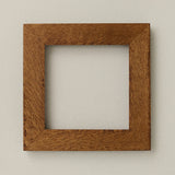Rookwood 8x8 Craftsman tile frame in golden oak with visible wood grain and thick border design
