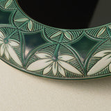 Close-up details of the one-of-a-kind mirror.