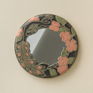 Hand-thrown and hand-glazed ceramic wall mirror by Rookwood Pottery