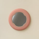 Hand-thrown and hand-glazed ceramic wall mirror by Rookwood Pottery
