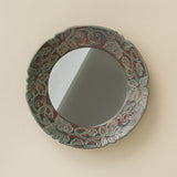 Hand-thrown and hand-glazed ceramic wall mirror by Rookwood Pottery