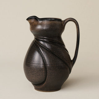 Hand-thrown and hand-glazed ceramic pitcher by Rookwood Pottery