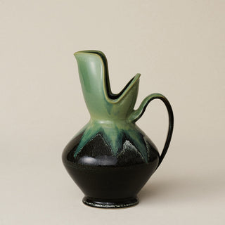 Hand-thrown and hand-glazed ceramic pitcher by Rookwood Pottery