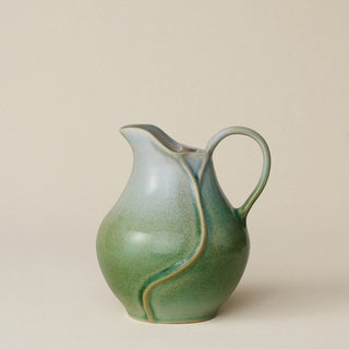 Hand-thrown and hand-glazed ceramic pitcher by Rookwood Pottery