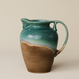 Hand-thrown and hand-glazed ceramic pitcher by Rookwood Pottery