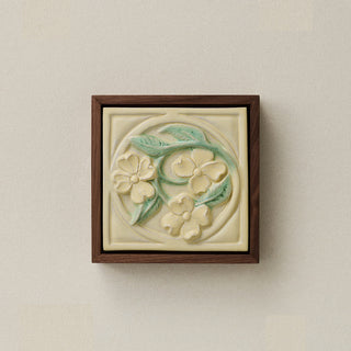 Sculpted decorative tile in wood frame by Rookwood