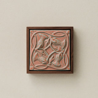 Sculpted decorative tile in wood frame by Rookwood