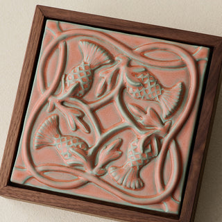 Close-up details of the sculpted tile, with visible carvings and layered glaze.