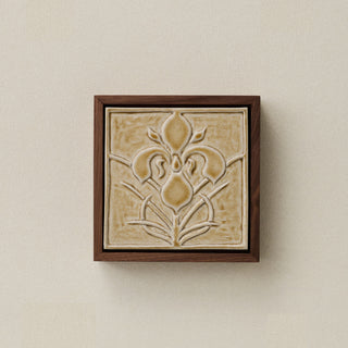 Sculpted decorative tile in wood frame by Rookwood