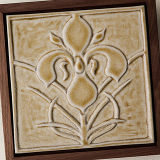 Close-up details of the sculpted tile, with visible carvings and layered glaze.