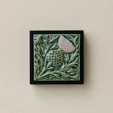 Sculpted decorative tile in wood frame by Rookwood