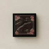 Sculpted decorative tile in wood frame by Rookwood
