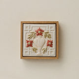Sculpted decorative tile in wood frame by Rookwood