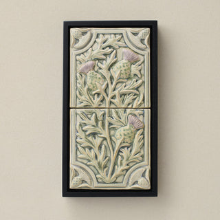 Sculpted decorative tile in wood frame by Rookwood