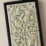 Close-up details of the sculpted tile, with visible carvings and layered glaze.