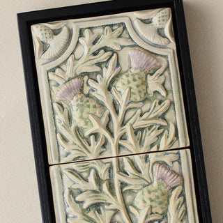 Close-up details of the sculpted tile, with visible carvings and layered glaze.